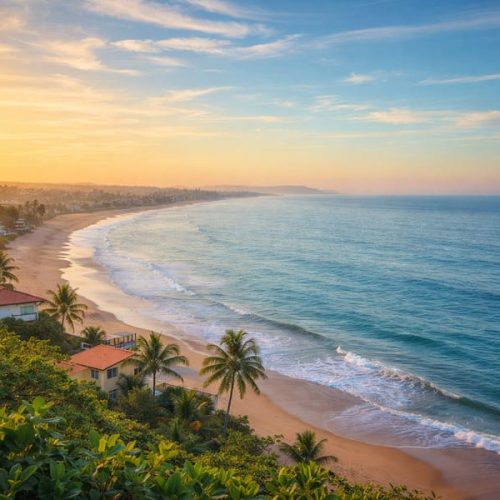 Vista aérea de cidade litorânea ao pôr do sol, ilustrando como morar perto do mar faz bem para a saúde e contribui para bem-estar e qualidade de vida.